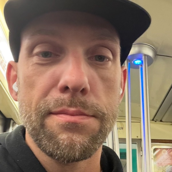 Martin, founder of KeyFu, in a black cap and a black hoodie